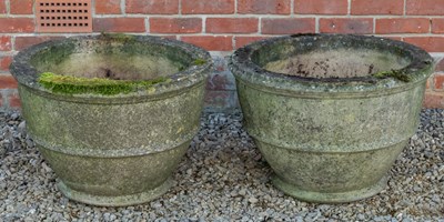 Lot 1167 - A pair of cast reconstituted stone urns