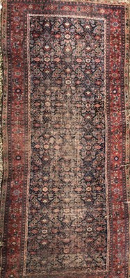 Lot 18 - An antique Oriental blue ground rug