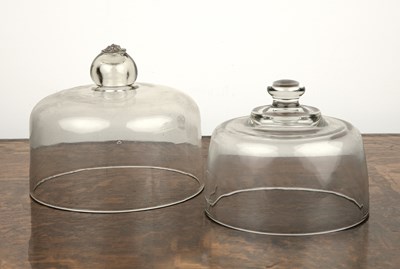 Lot 351 - Two GWR glass food covers each with a knop...