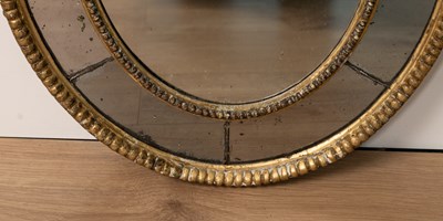 Lot 40 - An antique small oval wall mirror