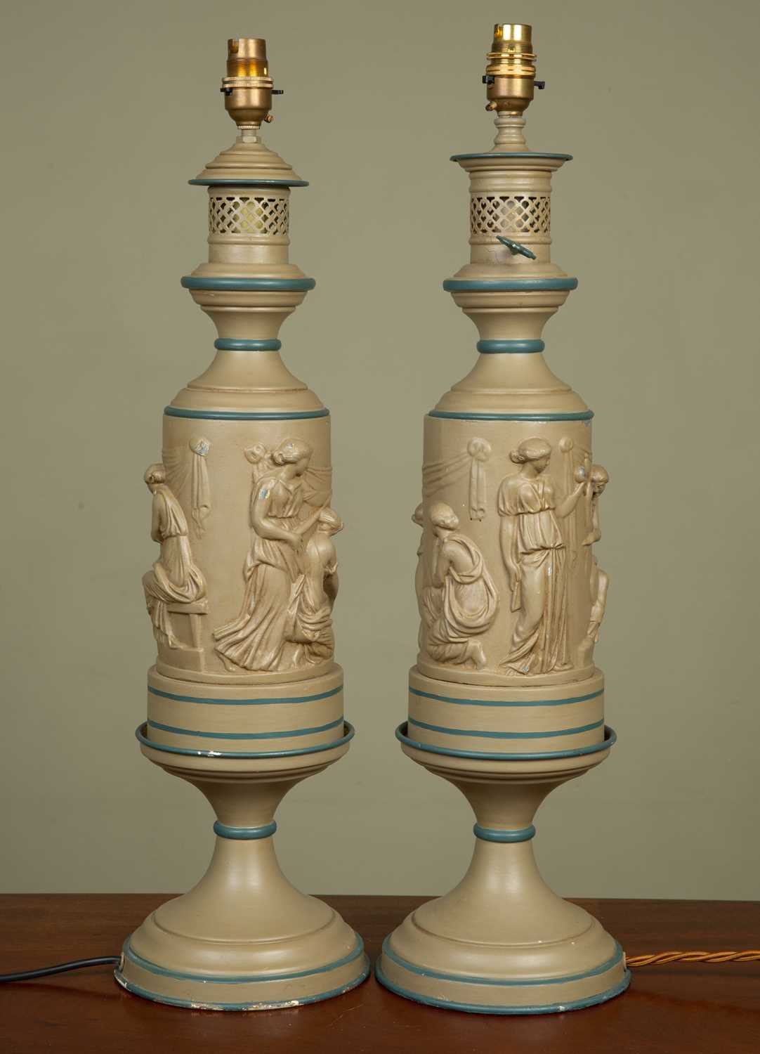 Lot 500 - A pair of Greek style lamp stands