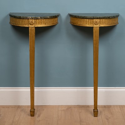 Lot 350 - A pair of 19th century green marble-topped gilt console tables