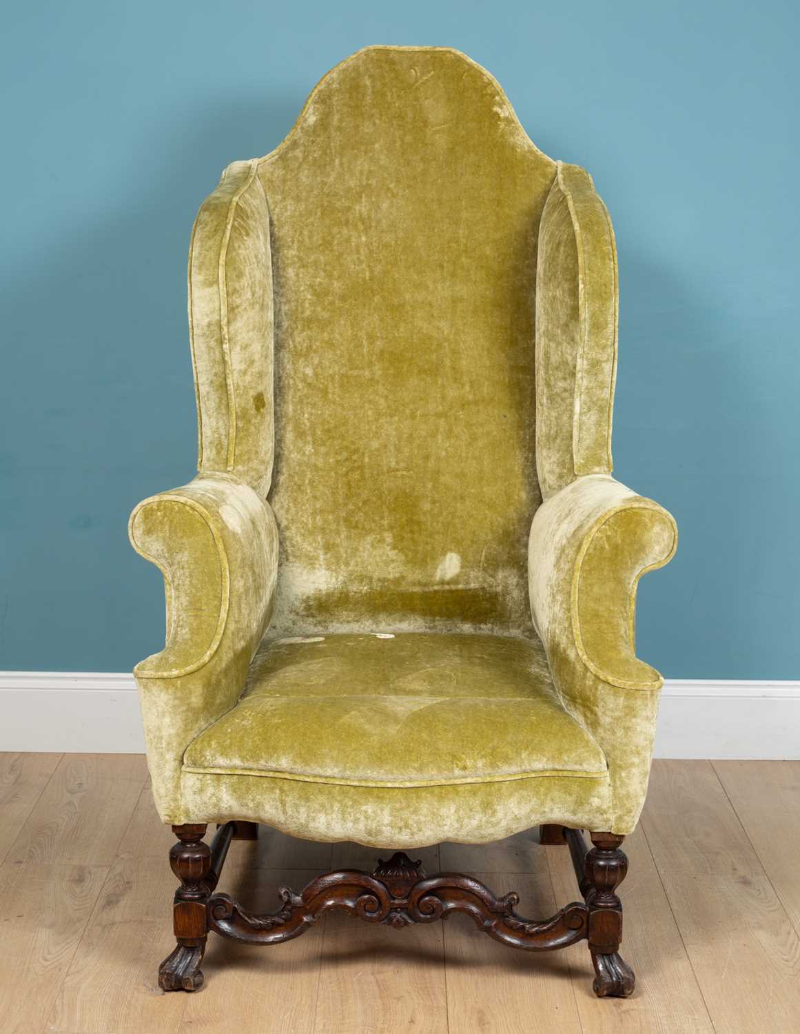 Lot 96 - A 19th century crushed sage green velvet wingback armchair