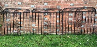 Lot 1208 - A group of three similar black painted wrought iron garden gates