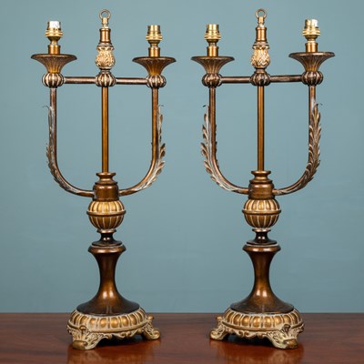 Lot 160 - A pair of continental Empire style lamp stands