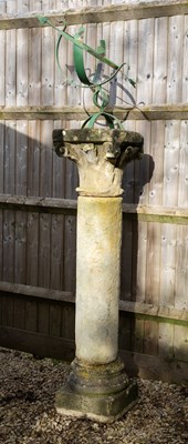 Lot 1105 - A sandstone column with a green painted wrought iron armillary sundial