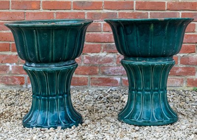 Lot 1158 - A pair of green glazed Oriental style planters