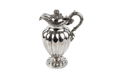 Lot 857 - A William IV silver claret jug, of lobed...