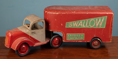 Lot 348 - A mid-20th century painted wood and tin toy lorry