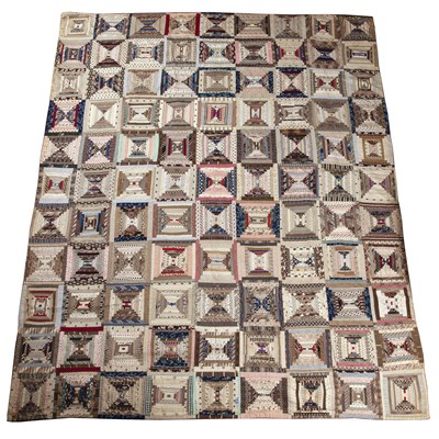 Lot 157 - A late Victorian patchwork quilt with rows of...