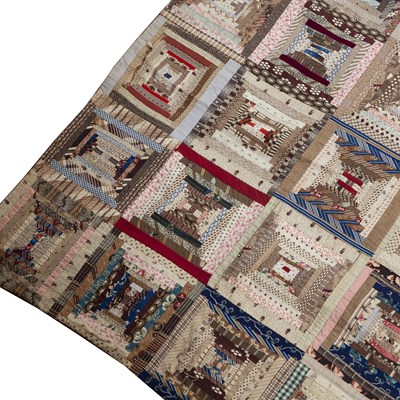 Lot 157 - A late Victorian patchwork quilt with rows of...