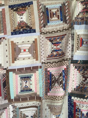 Lot 157 - A late Victorian patchwork quilt with rows of...