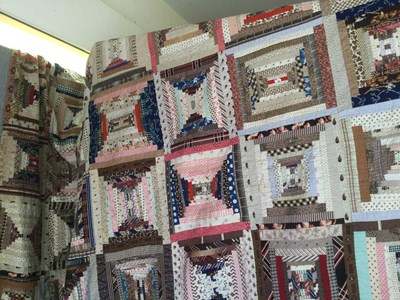 Lot 157 - A late Victorian patchwork quilt with rows of...