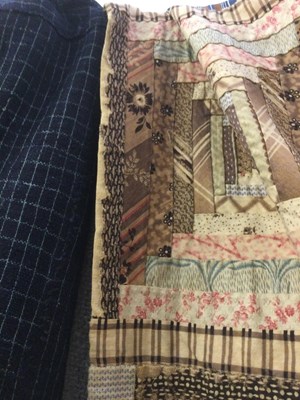 Lot 157 - A late Victorian patchwork quilt with rows of...