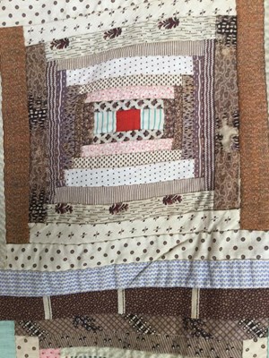 Lot 157 - A late Victorian patchwork quilt with rows of...