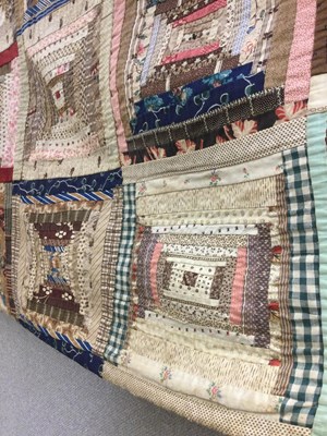 Lot 157 - A late Victorian patchwork quilt with rows of...