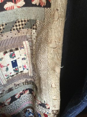 Lot 157 - A late Victorian patchwork quilt with rows of...