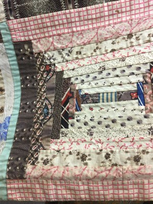 Lot 157 - A late Victorian patchwork quilt with rows of...