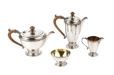 Lot 856 - A silver four piece tea service, relief...