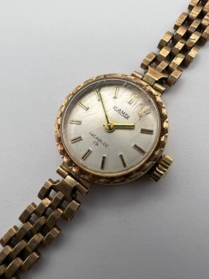 Lot 192 - A lady's 9ct gold bracelet watch by Roamer,...