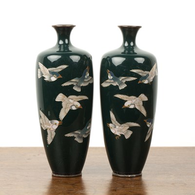 Lot 504 - Pair of dark green ground cloisonne vases...