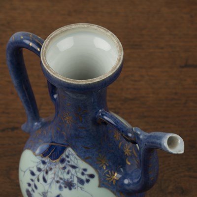 Lot 19 - Small porcelain powder blue and white ewer...