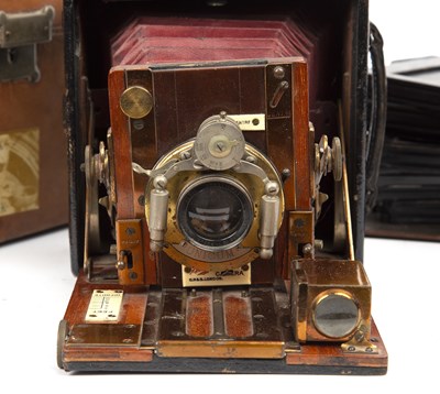 Lot 56 - The Sanderson camera with red leather bellows...