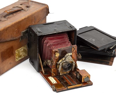 Lot 56 - The Sanderson camera with red leather bellows...