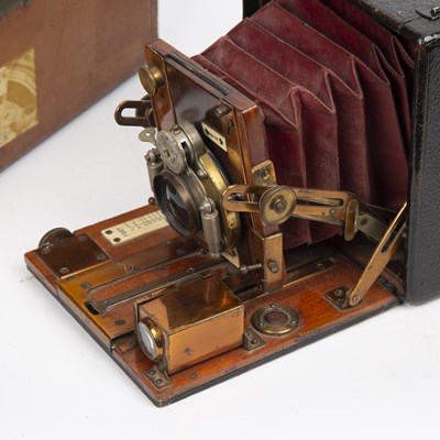 Lot 56 - The Sanderson camera with red leather bellows...