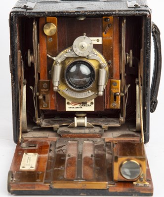 Lot 56 - The Sanderson camera with red leather bellows...