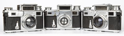 Lot 57 - Three Zeiss Ikon Contax cameras with lens...