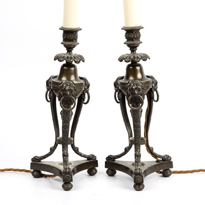 Lot 93 - A pair of Regency bronze candlesticks with...