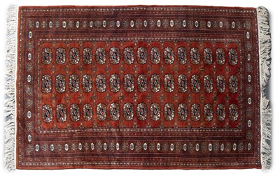 Lot 298 - A late 20th century Turkmen red ground rug...