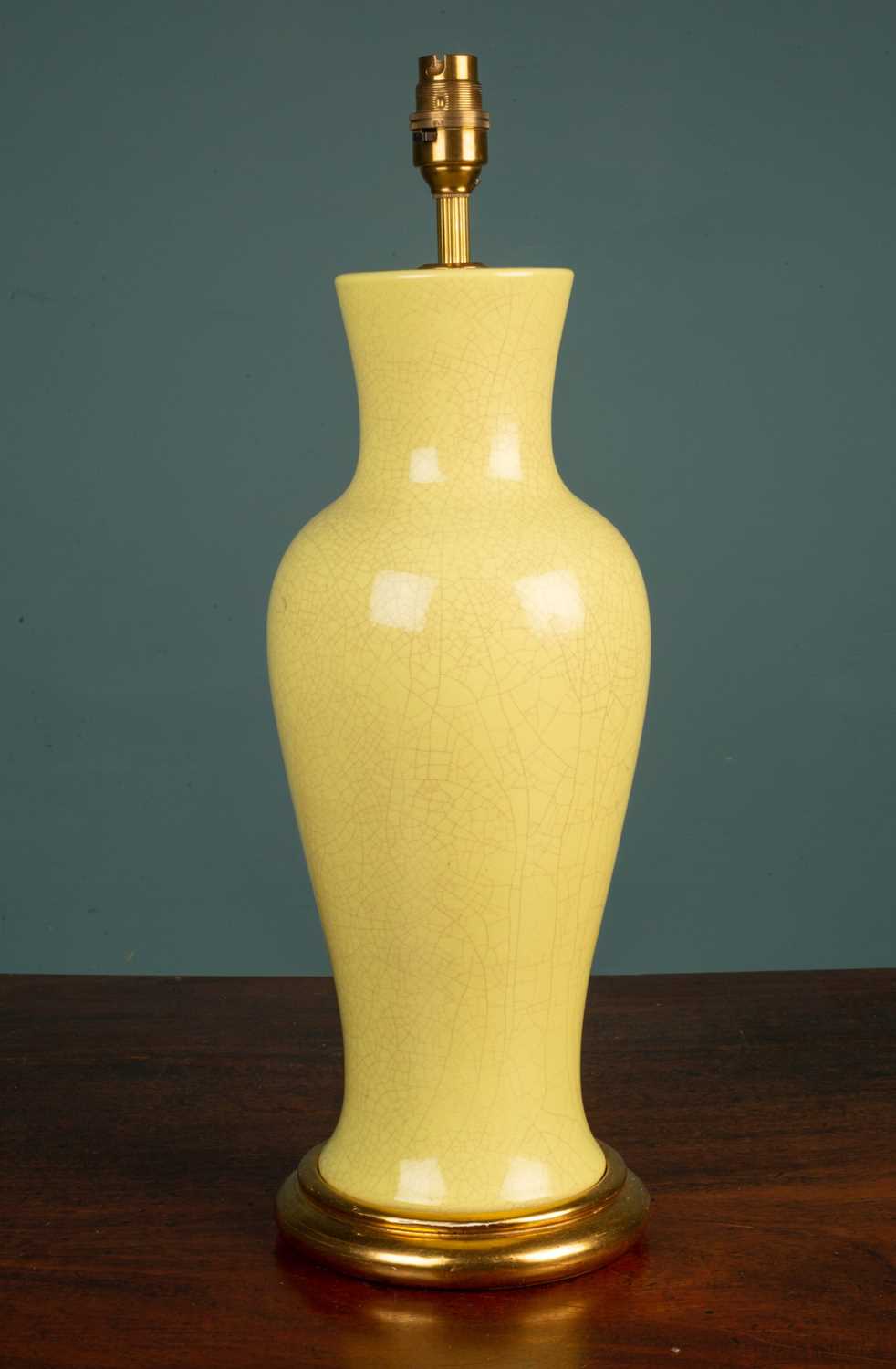 Lot 15 - A yellow crackle baluster shaped table lamp