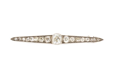 Lot 66 - A diamond bar brooch, designed as a line of...