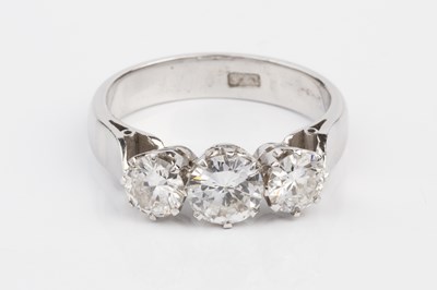 Lot 160 - A diamond three stone ring, the graduated...