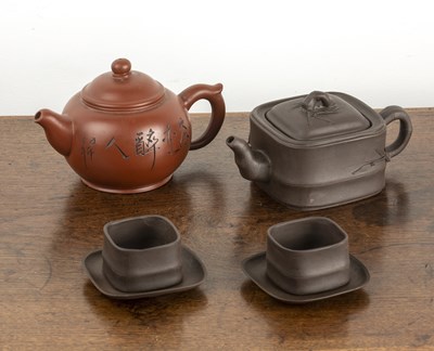 Lot 165 - Two Yixing teapots and two tea cups and...