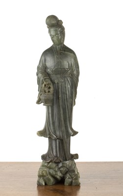 Lot 224 - Green soapstone carved model of Guanyin...