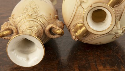 Lot 312 - Two Royal Worcester blush ivory vases one on a...