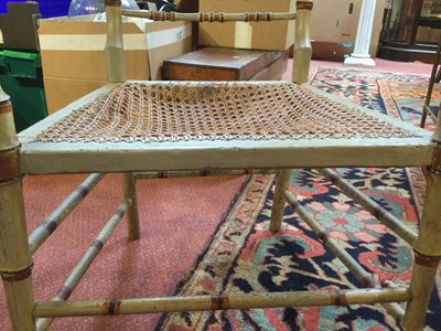 Lot 236 - A Regency painted faux bamboo open armchair...