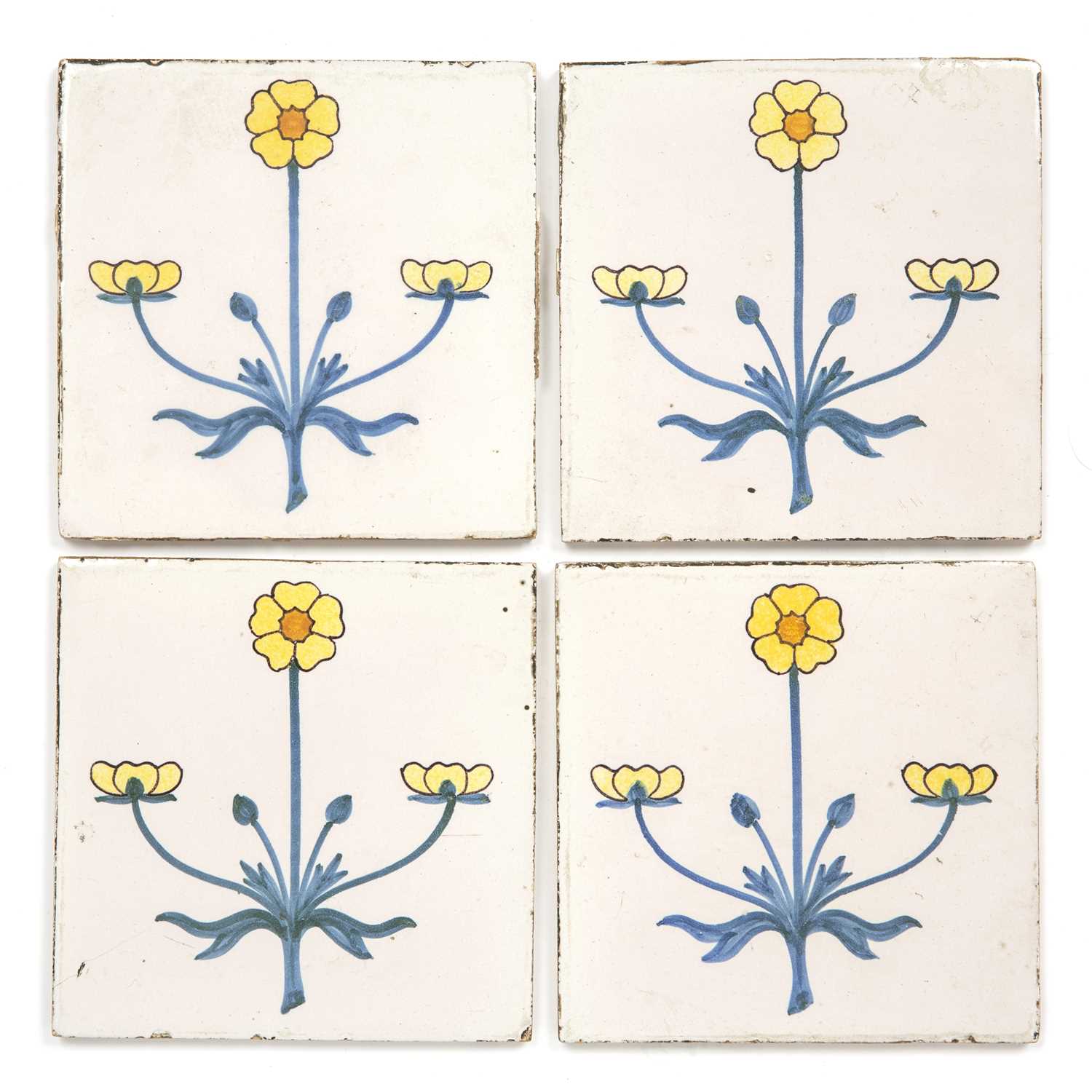 Lot 83 - A set of four Delft tiles each with flower...