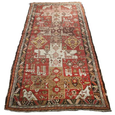 Lot 274 - A Persian Karabagh red ground rug with...