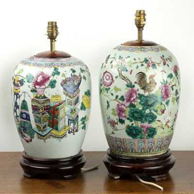 Lot 199 - Two famille rose enamelled vases/lamps Chinese,...