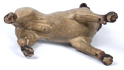 Lot 318 - An early 20th century pottery pug dog with...