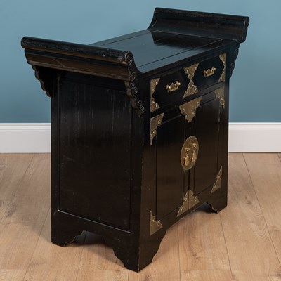 Lot 81 - An Oriental ebonised camphor wood side cabinet