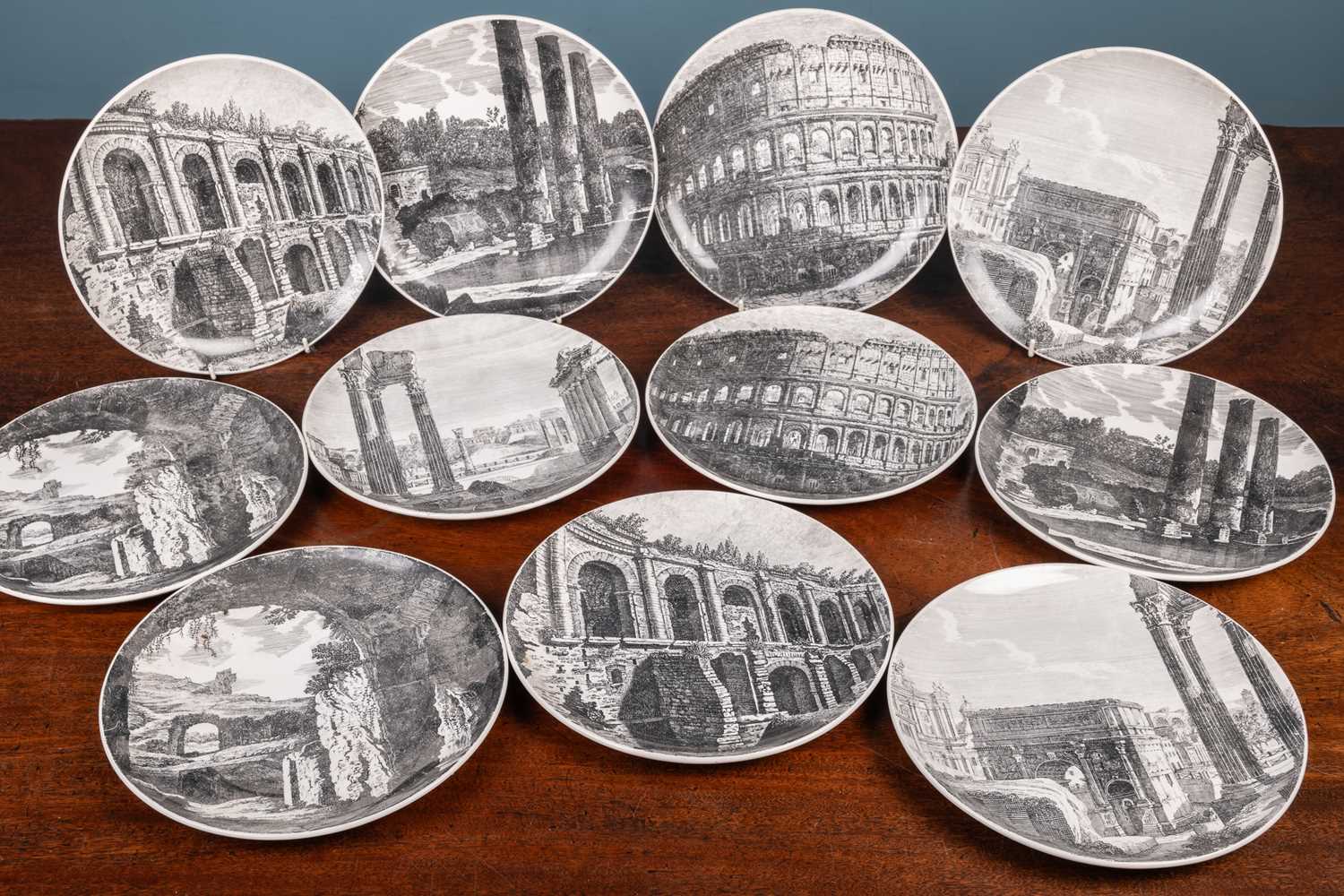 Lot 563 - A collection of eleven Fornasetti plates depicting views of Rome