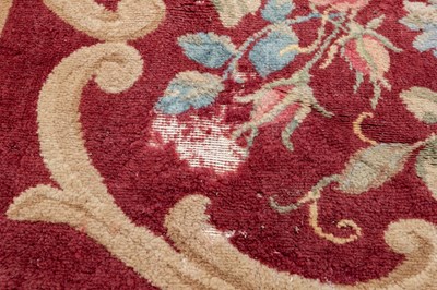 Lot 1048 - A red ground Kidderminster Axminster carpet