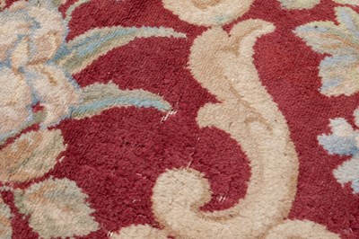 Lot 1048 - A red ground Kidderminster Axminster carpet