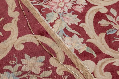 Lot 1048 - A red ground Kidderminster Axminster carpet