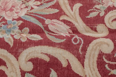 Lot 1048 - A red ground Kidderminster Axminster carpet